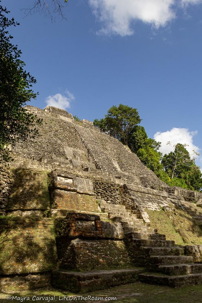 A tall pyramid with stairs, seen from below