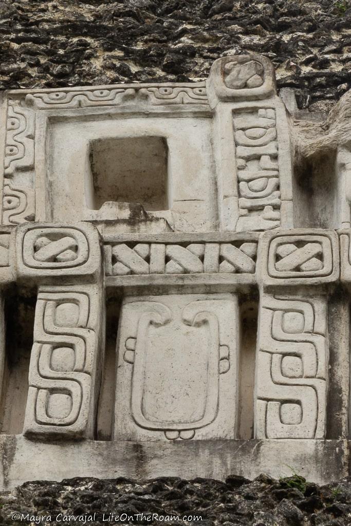 Stucco friezes with a U-shaped ornament and geometric adornments