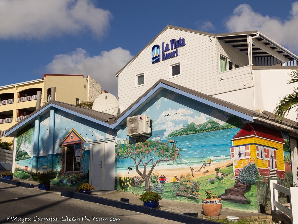 A colourful mural in a low-height building with the sign "La Vista Resort"