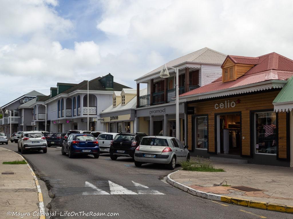A road with two-storey buildings matching traditional Caribbean architecture