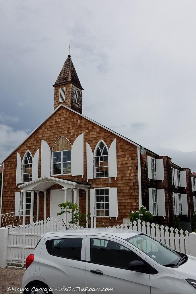 A church with a traditional Caribbean style with white doors and windows