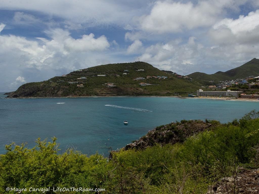 View of a green hill over the sea