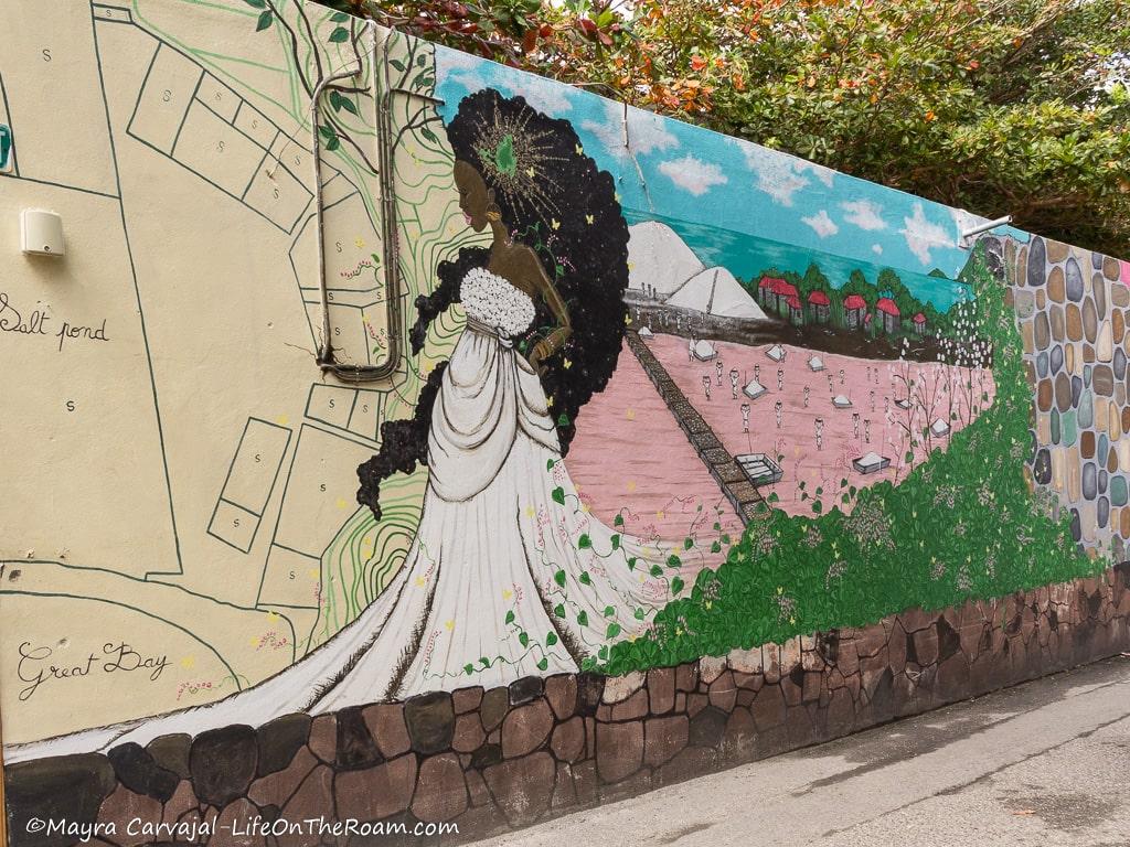 Mural with a black woman with long hair and white dress, with the background of a map and a salt flat