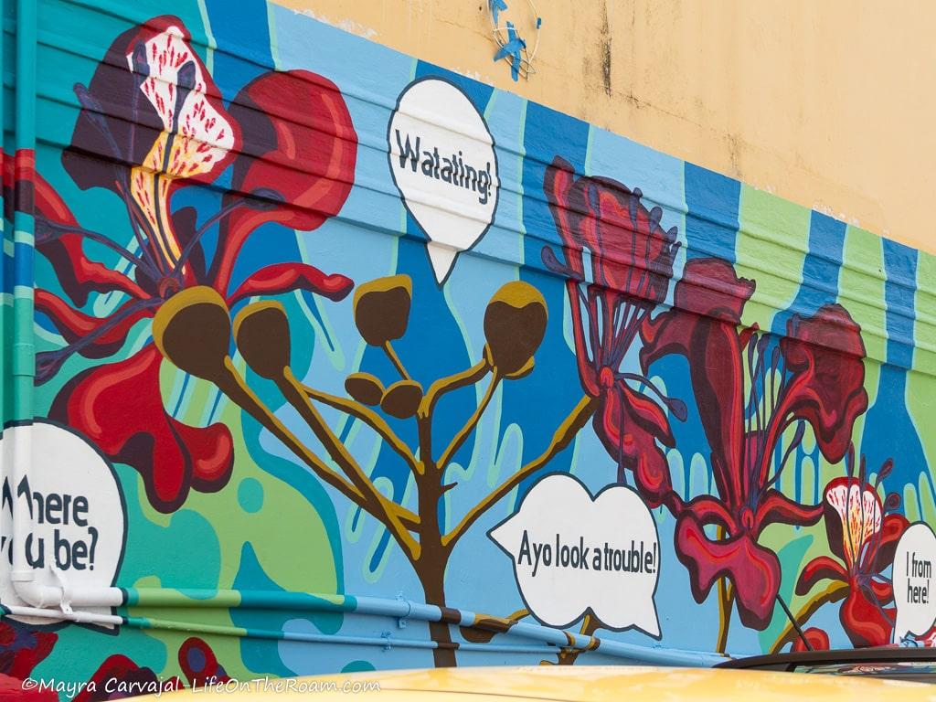A mural with an abstract landscape and common sayings in Sint Maarten