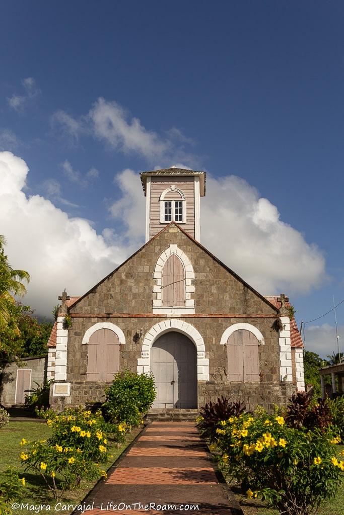 A church built with stone and a gabled roof
