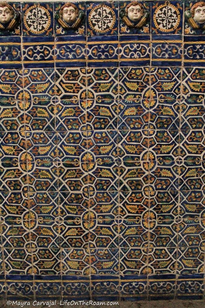 Hand-made glazed tiles covering the lower part of the wall in a church