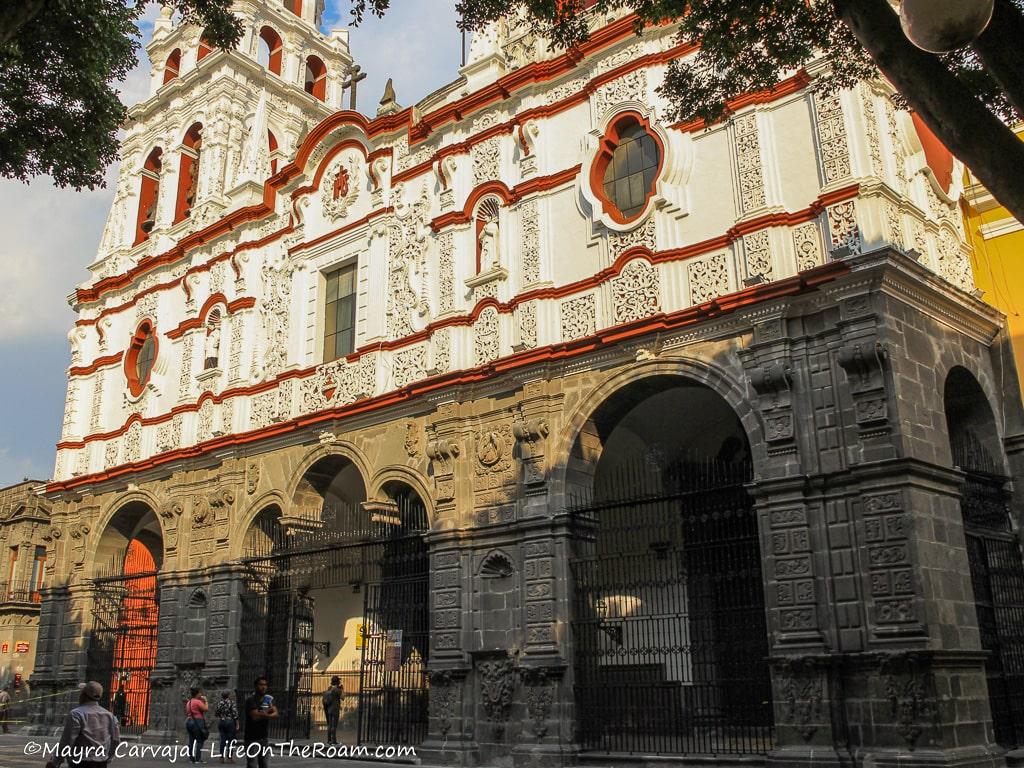 An old church with rough stone on the lower façade and decorated mortar on the upper section