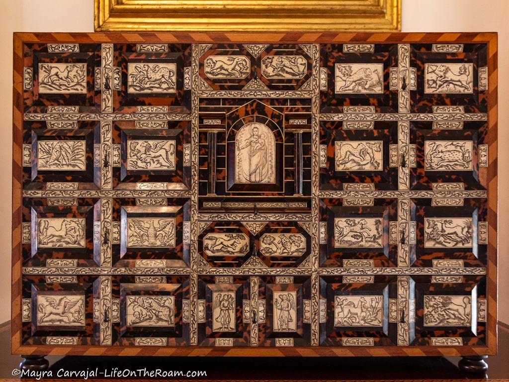 A desk organizer from the early 20th century in wood with highly detailed decoration