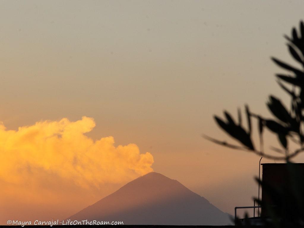 Distant view of a volcano at sunset