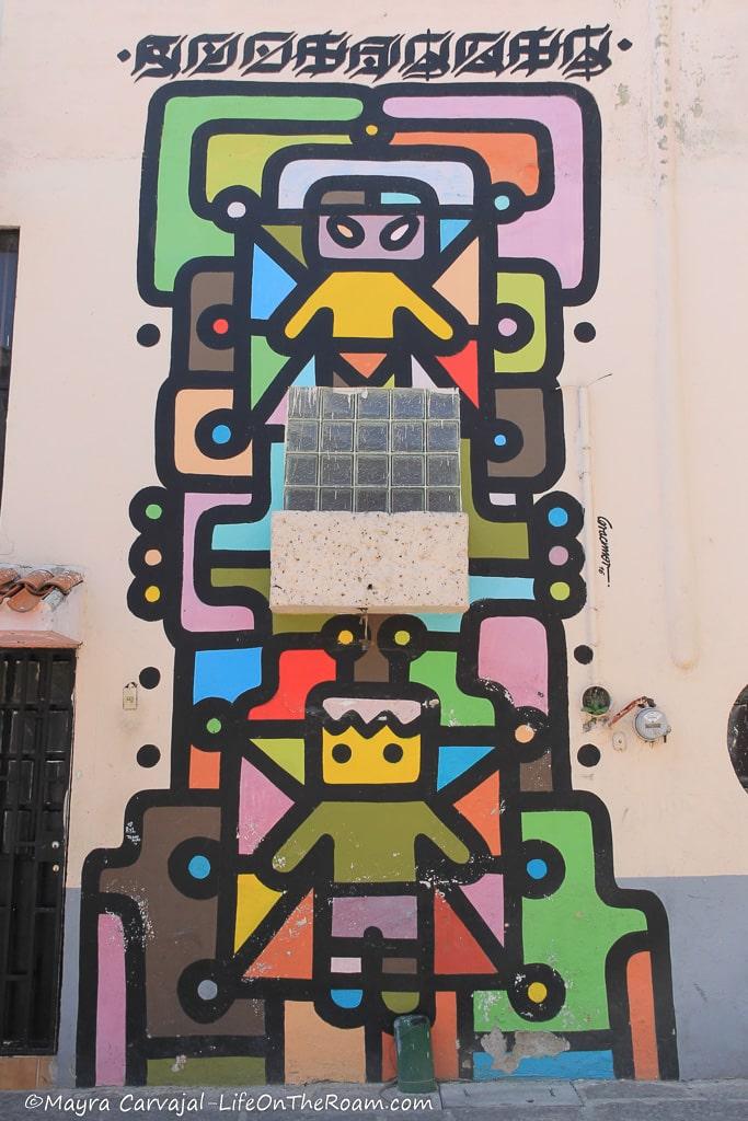 A colourful mural with kid-like features