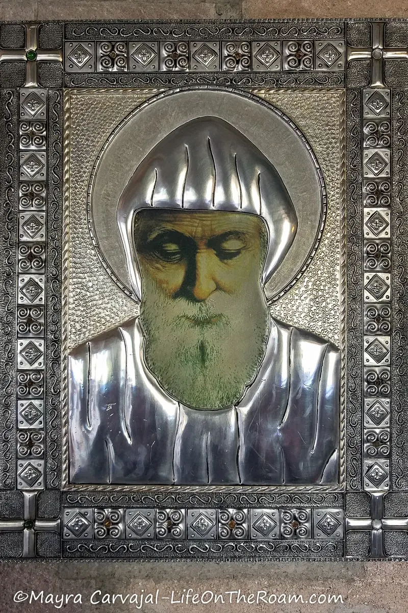 A painting of a religious figure with silver inlaid