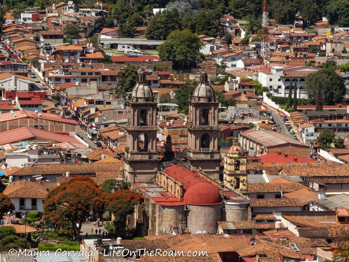 An aerial view of a colonial town with a big church