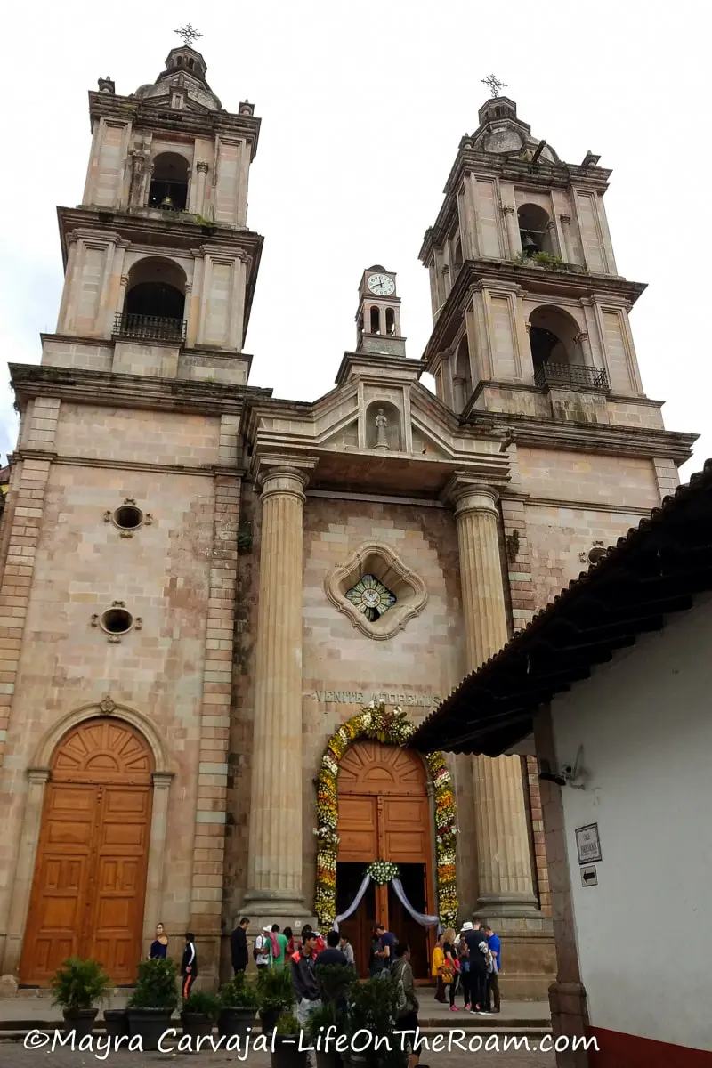 A church with neoclassical columns in the façade and two bell towers