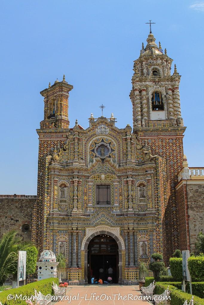 A church covered in multicolour tiles