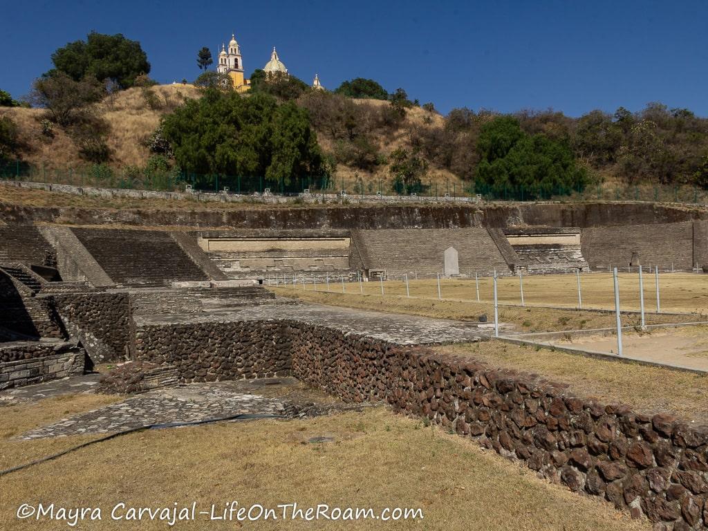 An open area surrounded by sloped walls