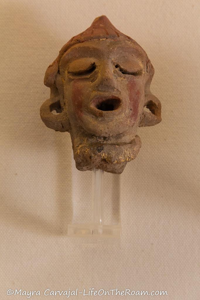 Clay figurine with an anthropomorphic shape