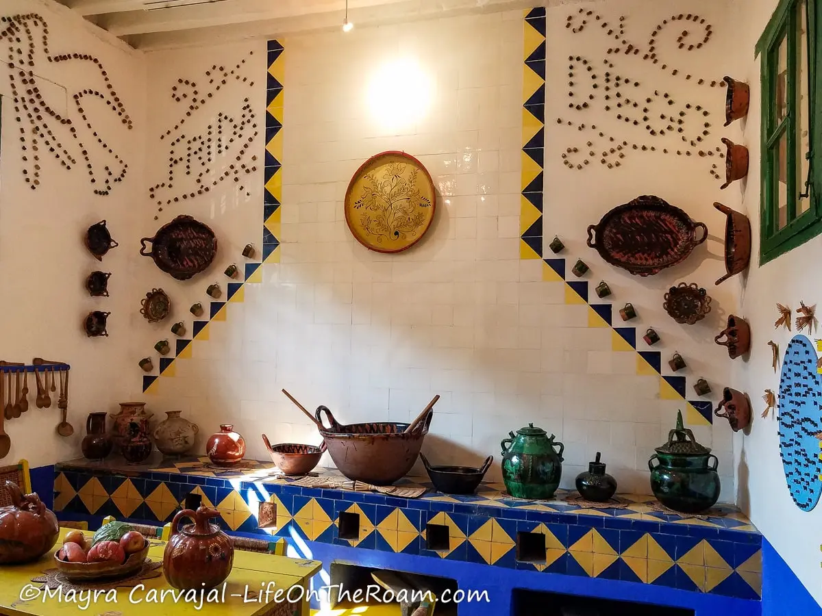 A traditional Mexican kitchen wit the names Frida and Diego written with tiny cups