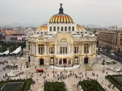 An Art Nouveau palace with domes and gardens in the front