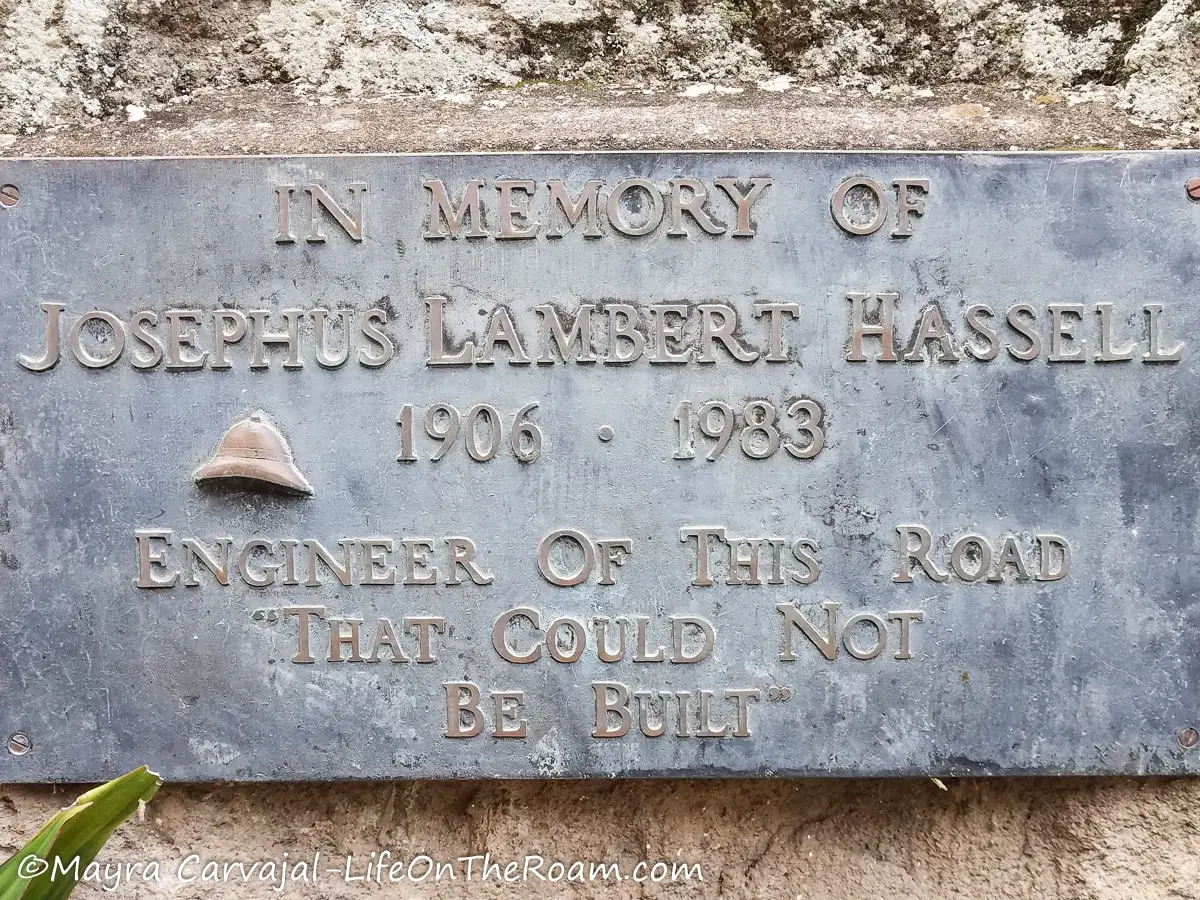 A metal plaque reading "In memory of Josephus "Lambert" Hassell", Engineer of this road that could not be built