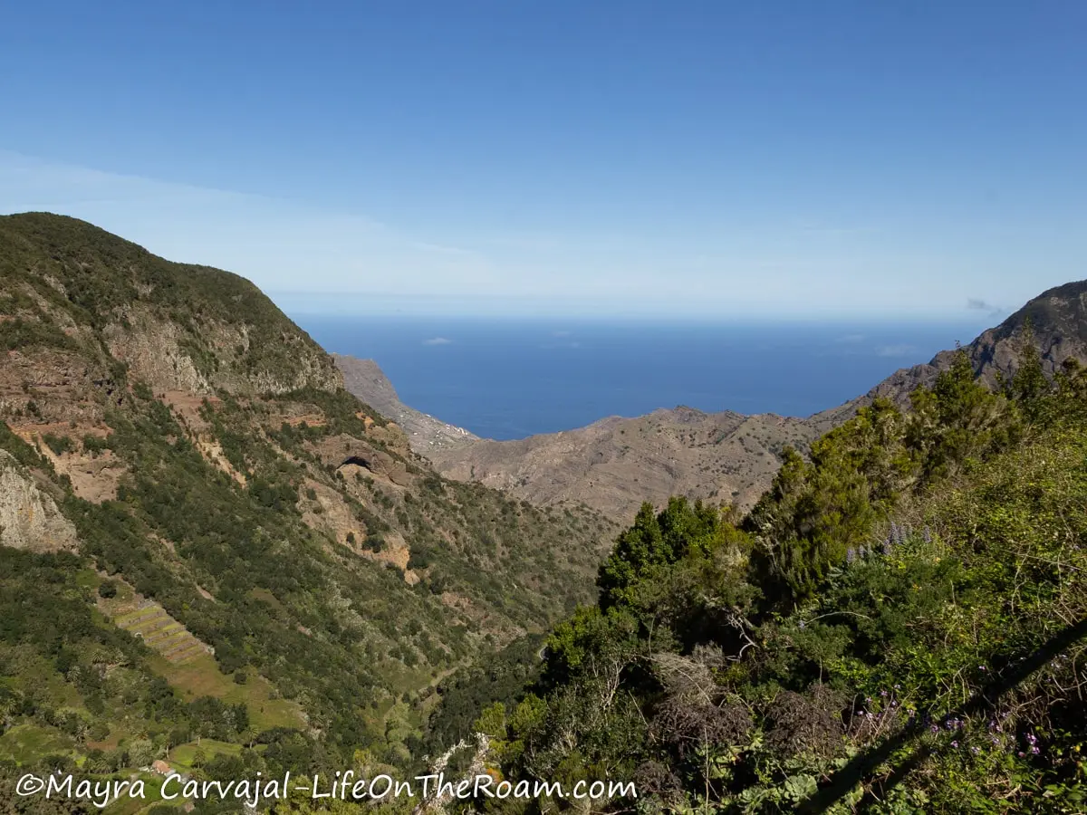 View of the sea at the end of a deep ravine 