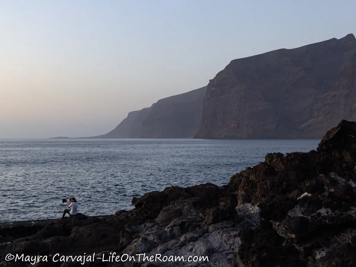 View of tall cliffs from the sea shore