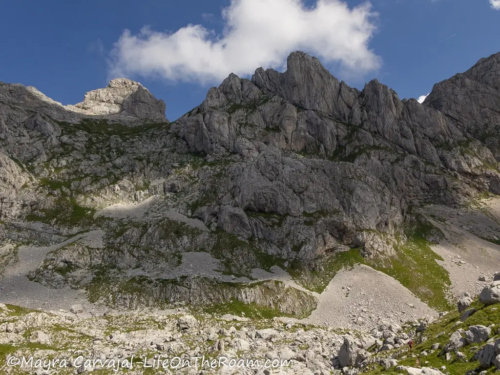 Two mountain peaks with rocks, seeing from below