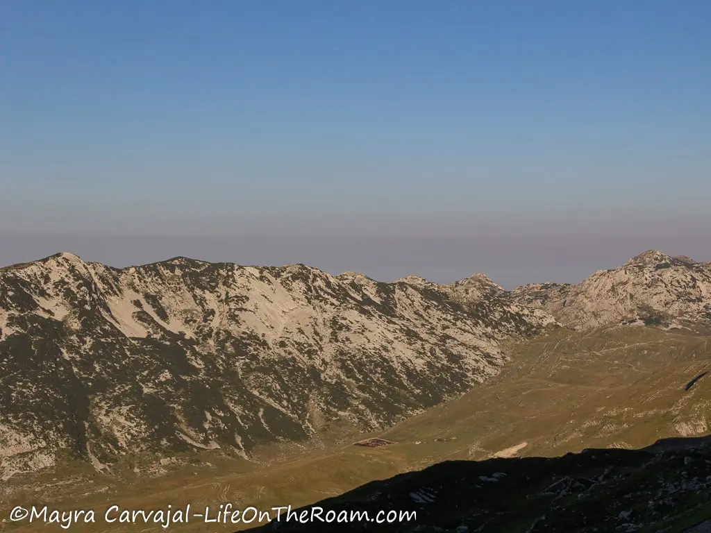 View of a mountain range across a valley