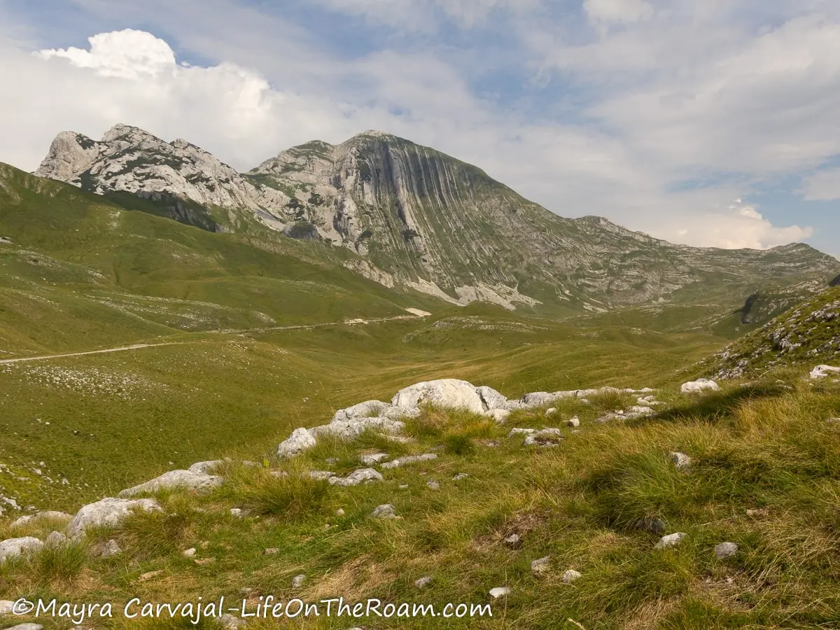 A peak with vertical layers with a valley in the forefront