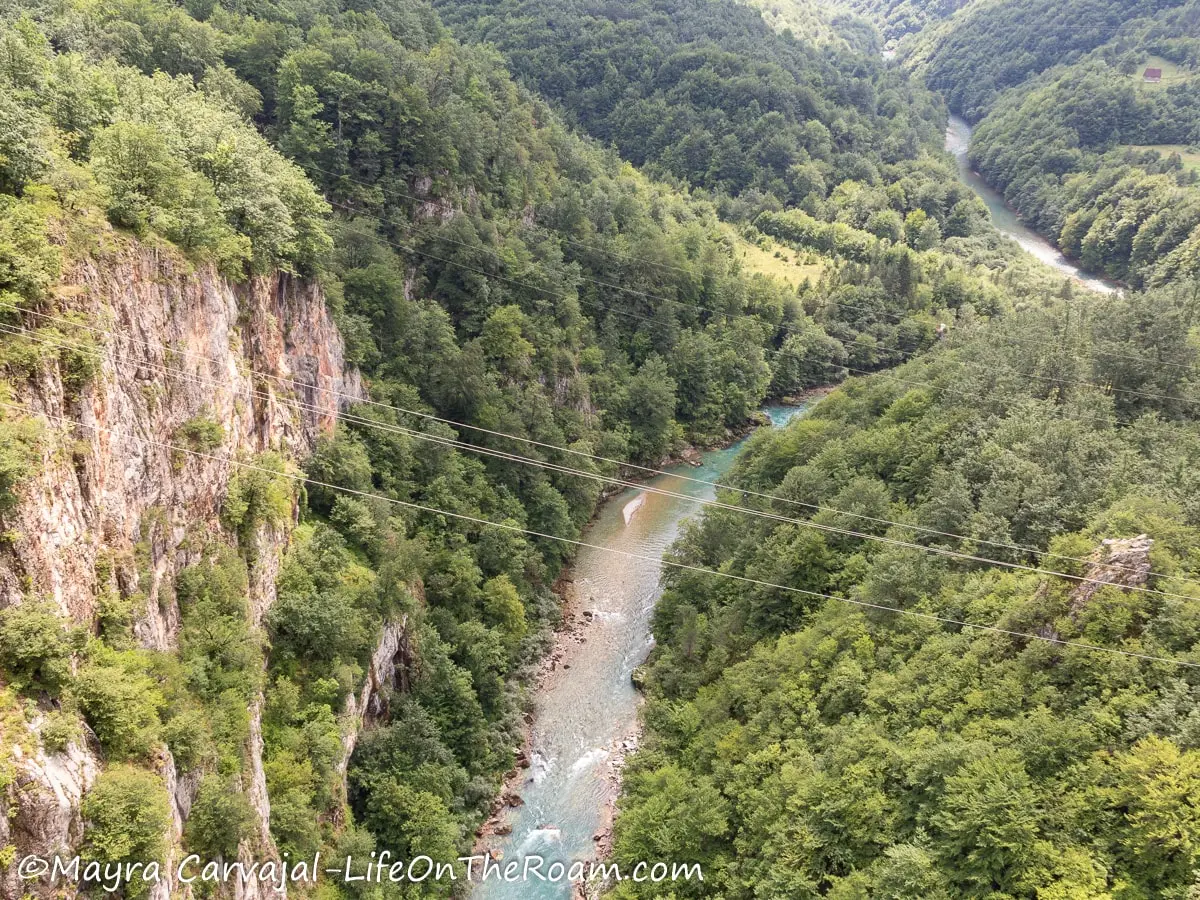 Zip lines across a deep river canyon