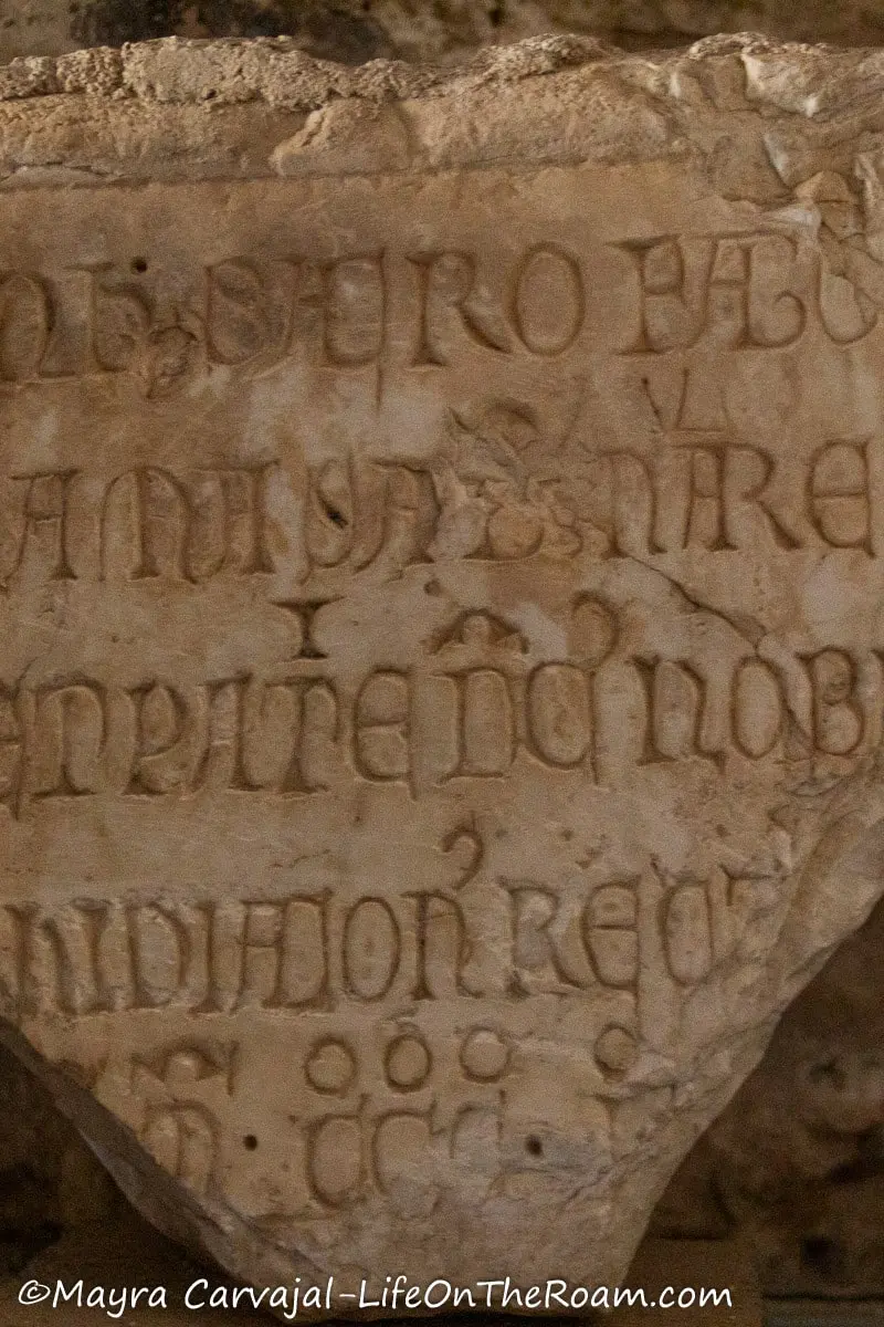 Fragments of a stone with handmade inscriptions in an ancient language