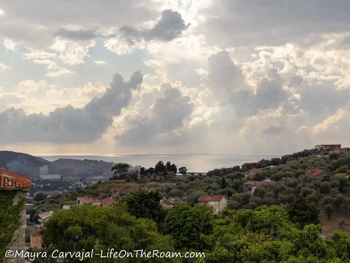 Distant View of the sea and a town from the mountain in a semi cloudy day