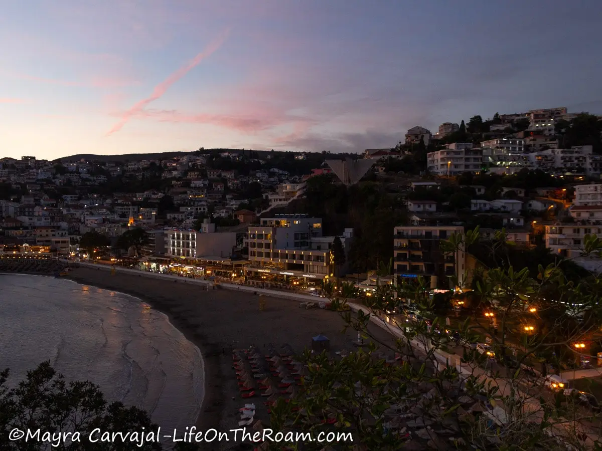 Aerial view of a sandy city beach early in the evening, 