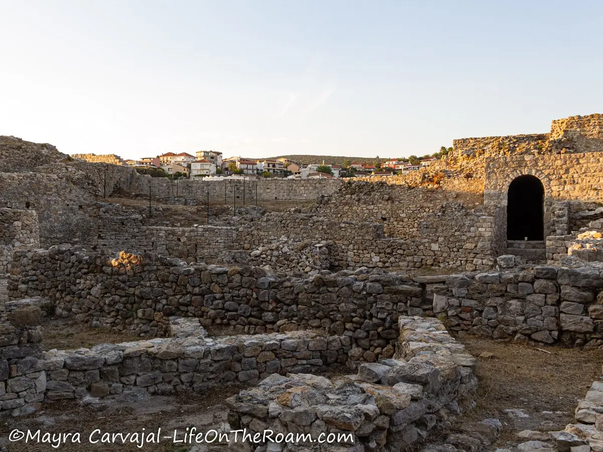 Ruins of an old citadel consisting of half walls made of cut stone