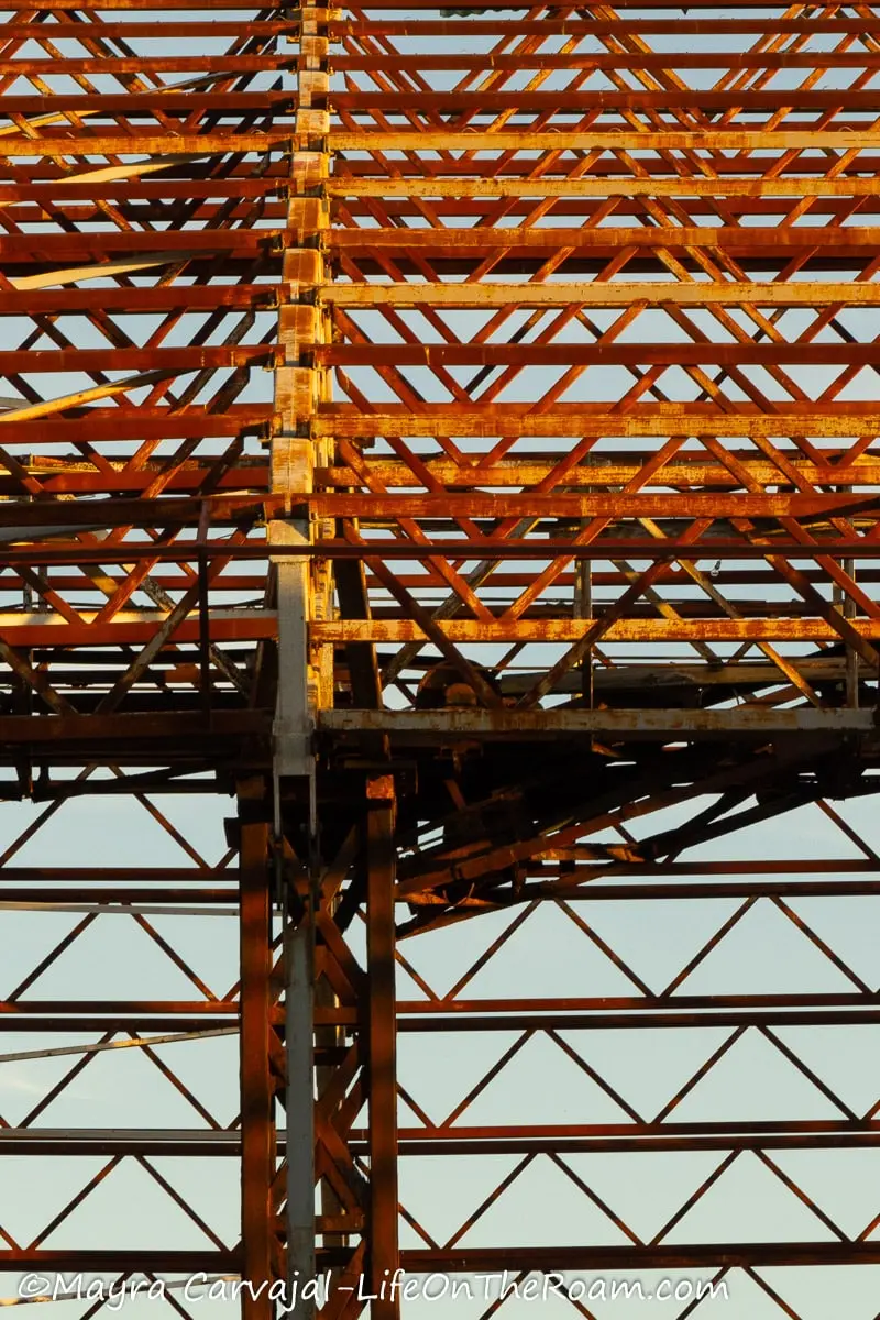 A rusted metal grid that supported a roof