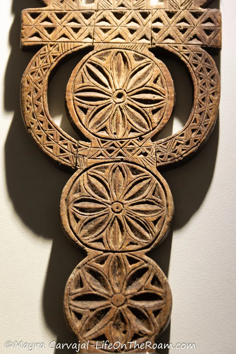 Intricate carvings on a wood distaff