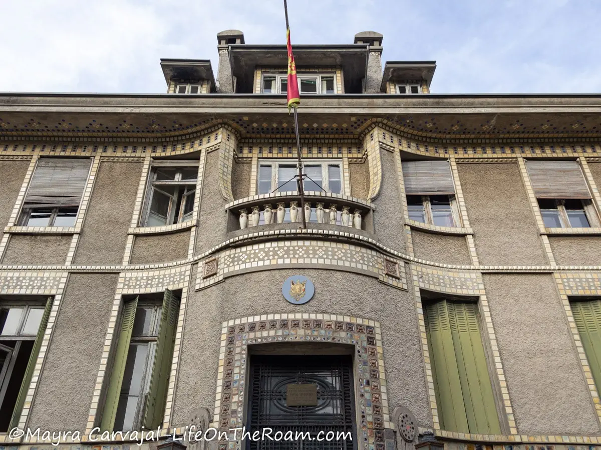 A building with a rounded entrance and decorative tiles