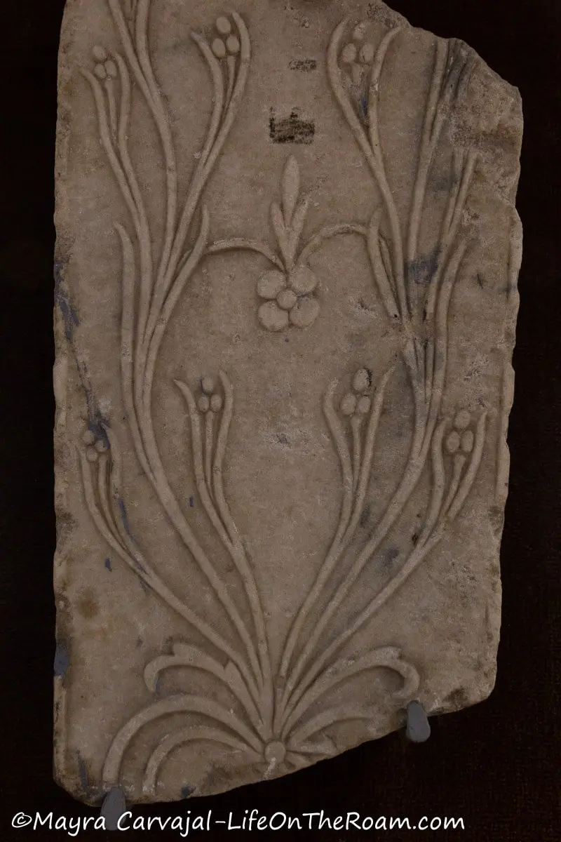 An ancient gravestone with foliage ornamentation