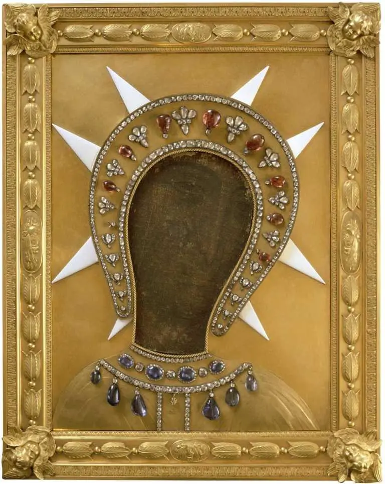 Old painting of Virgin Mary inside a gold riza with precious stones