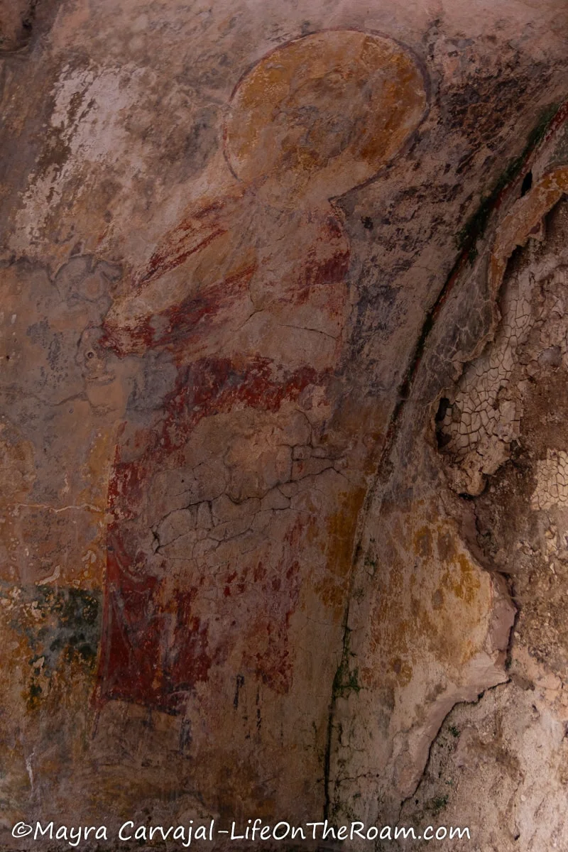 A fragment of a fresco depicting a saint of the church