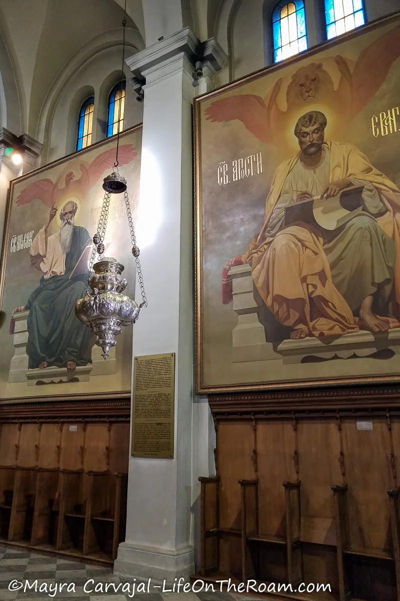 Two big format paintings of the evangelist inside a church