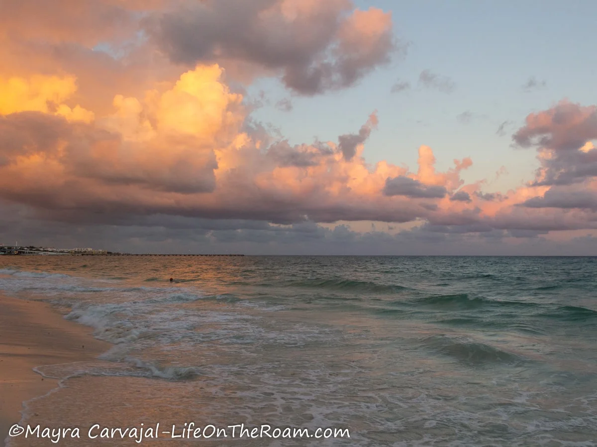 Clouds illuminated by the sun and sunset in the sea