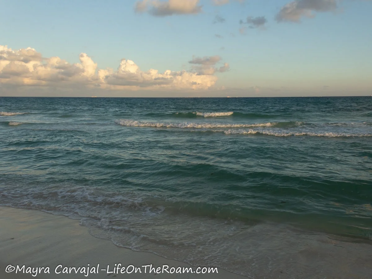 Gentle waves crashing on a sandy beach