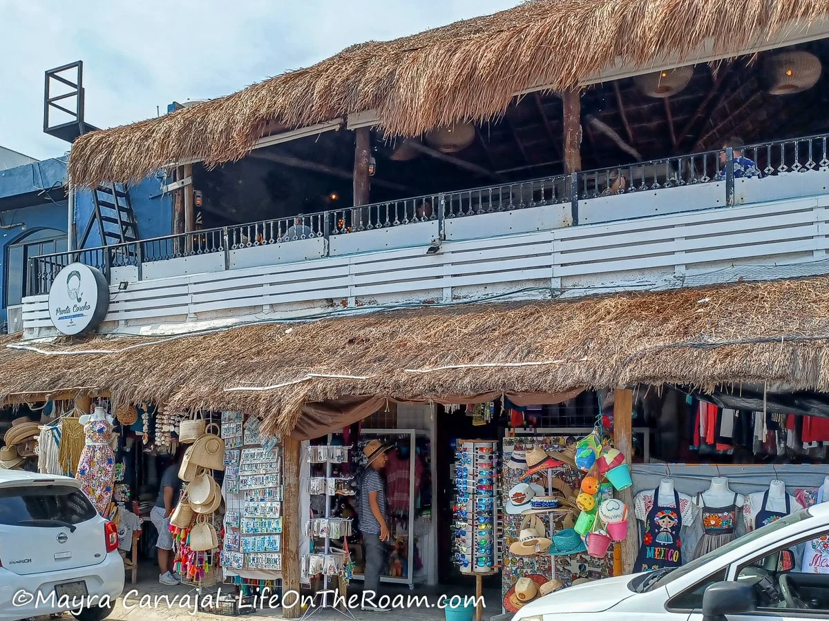 A market on the outside of the first floor on a building