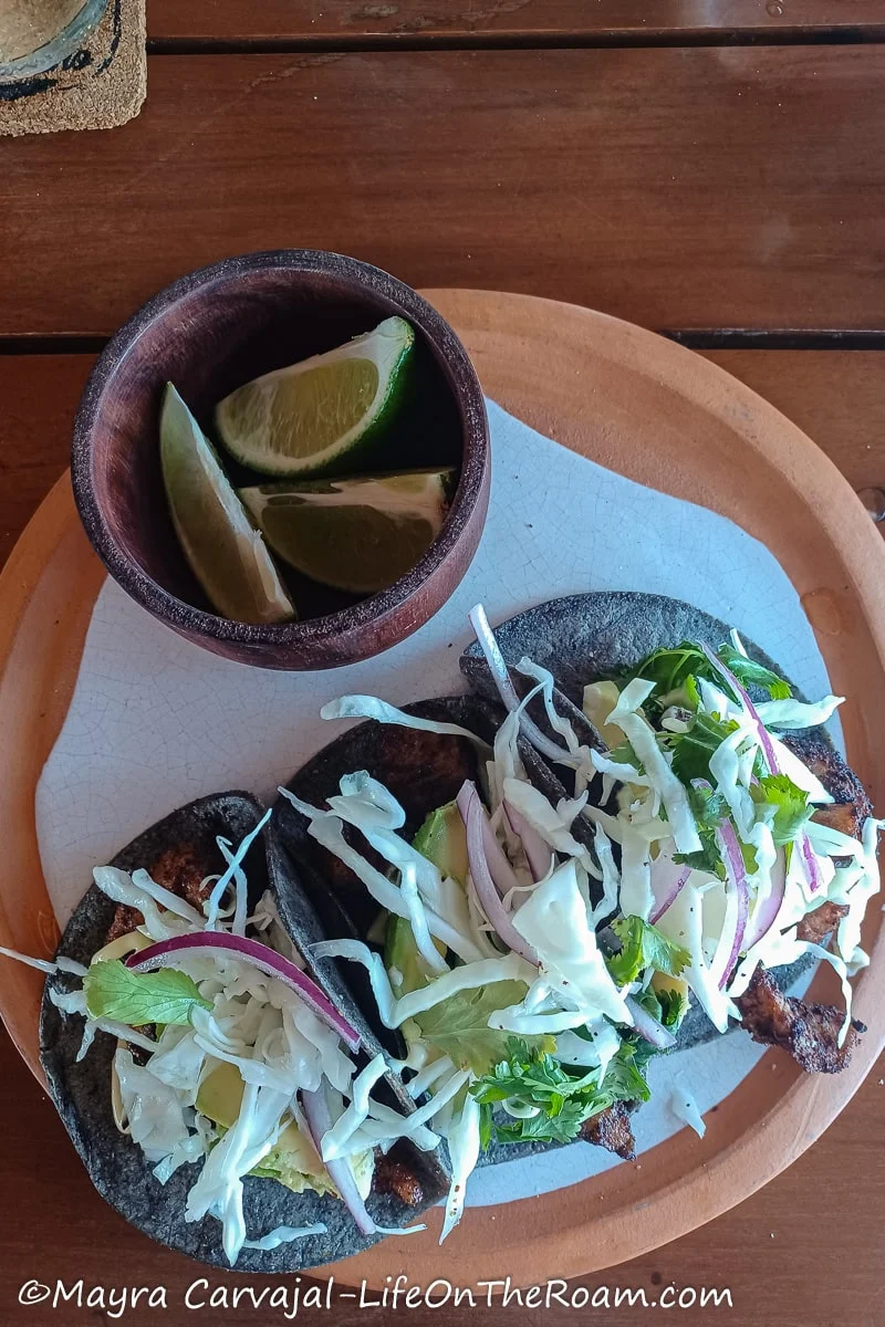 Three tacos in a plate