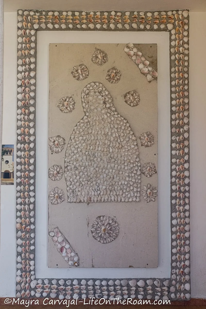 A simple mosaic of Virgin Mary done with shells