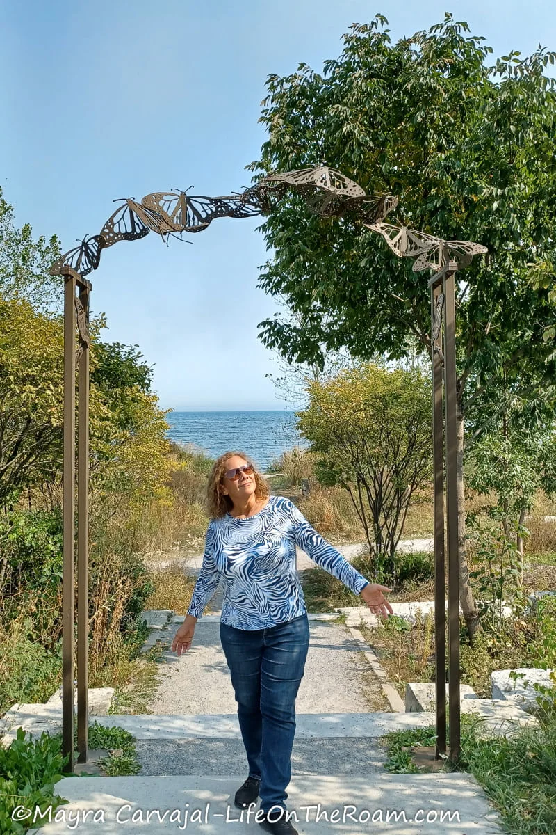 Mayra at the entrance of a pollinator trail