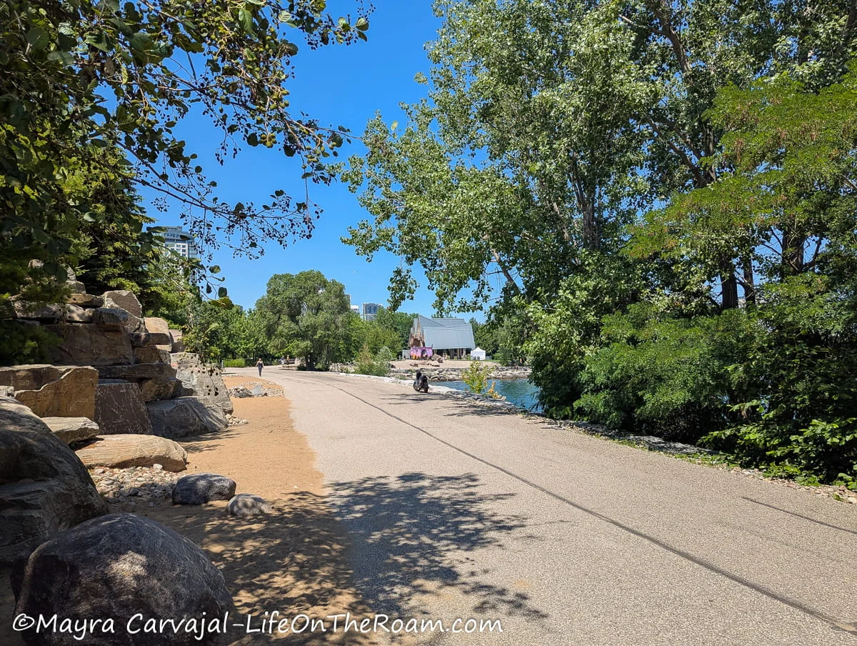 Big boulders on the side of a lakefront pathway